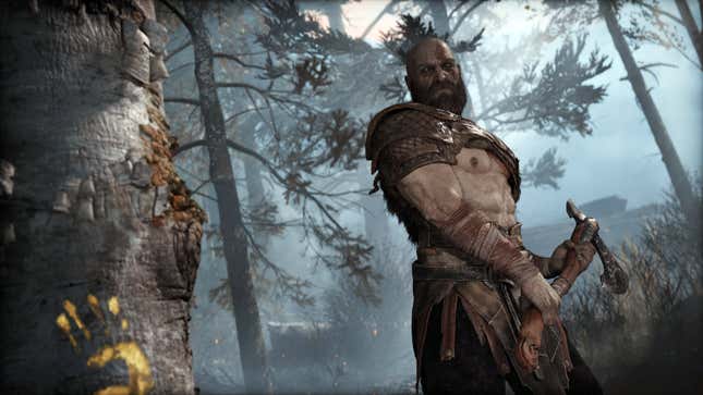 Kratos holds an axe, ready to strike a tree.