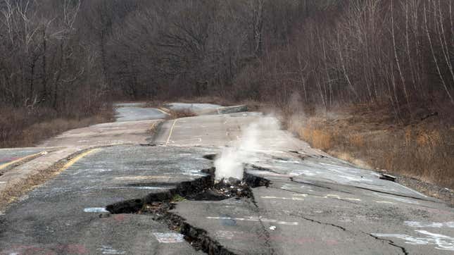 Smoke rises from a large crack in Pennsylvania Highway 61, caused by the underground coal fire.