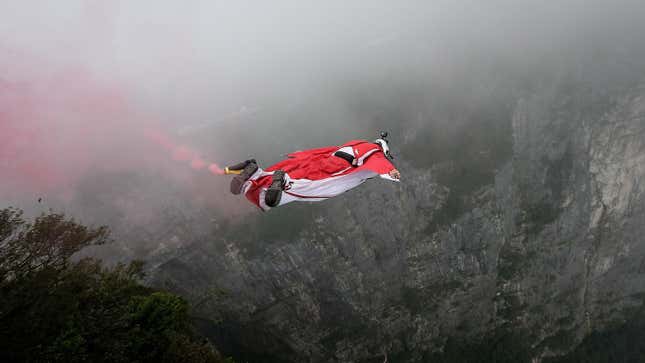 Wingsuit flyer Niccolo Porcella of USA jumps off a mountain during the 7th World Wingsuit Championship at Tianmen Mountain on September 15. 2018 Zhangjiajie, Hunan province, China