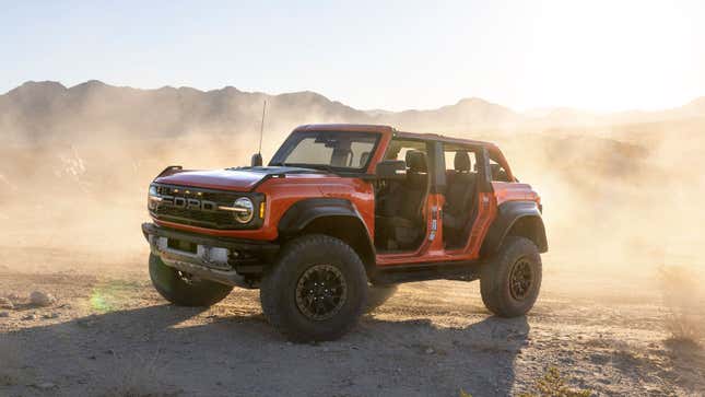 A photo of an orange Ford Bronco Raptor. 