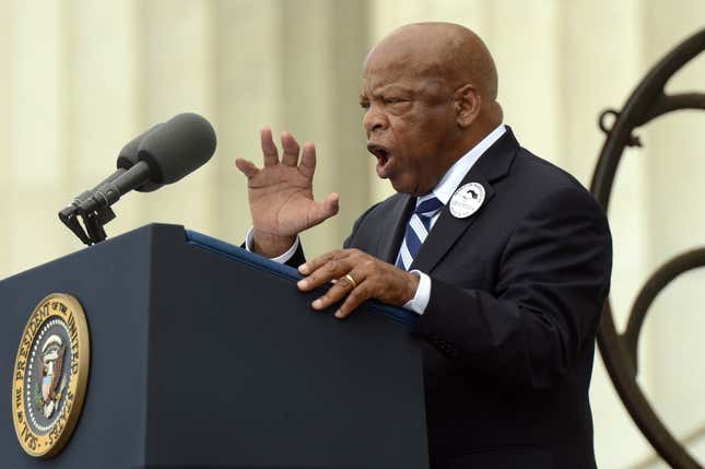 The late civil rights leader and Georgia congressman John Lewis delivers remarks in front of a freedom bell during the “Let Freedom Ring” commemoration event August 28, 2013, in Washington, DC. The event was to commemorate the 50th anniversary of Dr. Martin Luther King Jr.’s “I Have a Dream” speech and the March on Washington for Jobs and Freedom.