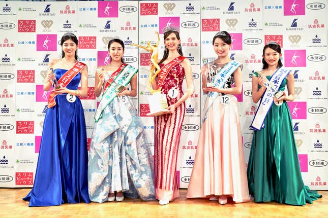 CORRECTS NAME SPELLING: Contestants including Carolina Shiino, who won the Miss Nippon (Japan) Grand Prix, center, pose for a photo after the contest in Tokyo, Monday, Jan. 22, 2024. Crowned Miss Japan this week, Ukrainian-born Carolina Shiino cried with joy, thankful for the recognition of her identity as Japanese. (Miss Nippon Association via AP)