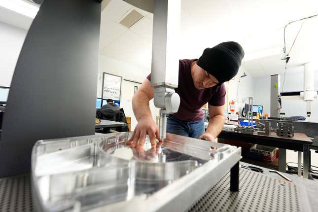 FILE - A worker at Reata Engineering and Machine Works prepares a Hexagon machine used to confirm that parts meet customer standards on Feb.15, 2024, in Englewood, Colo. On Thursday, March 14, 2024, the Labor Department releases producer prices data for February. (AP Photo/David Zalubowski, File)