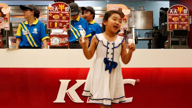 Young customer holds ice cream purchased at a KFC in Beijing