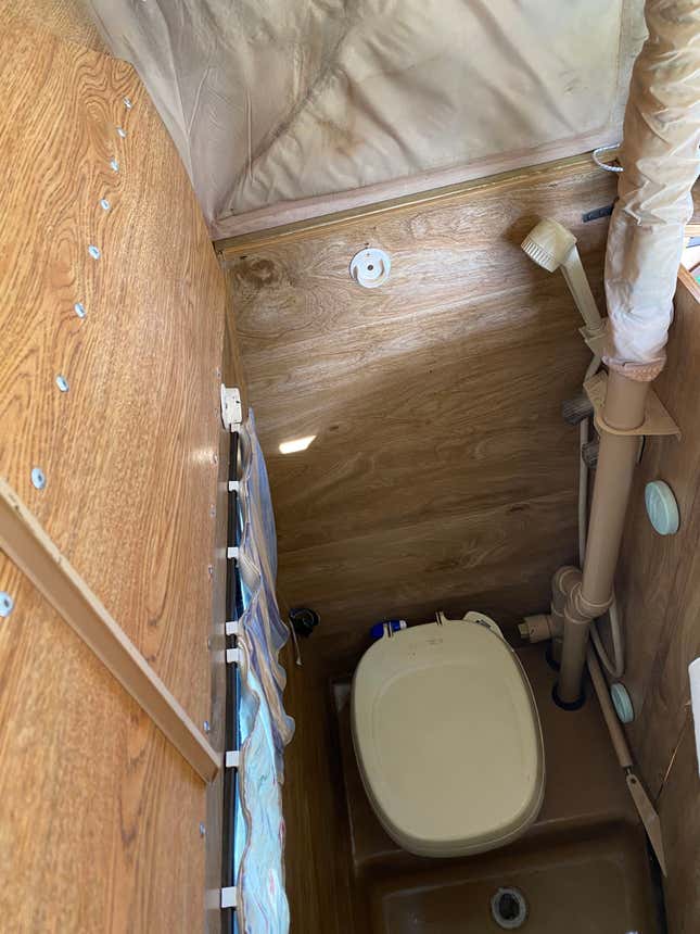 A photo of the toilet space in the astro van