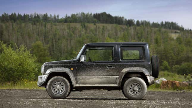 A photo of a black Suzuki Jimny SUV. 