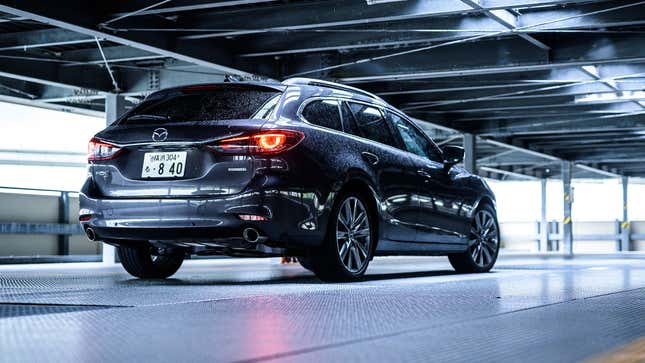 Rear-quarter view of a Mazda 6 wagon in gray.