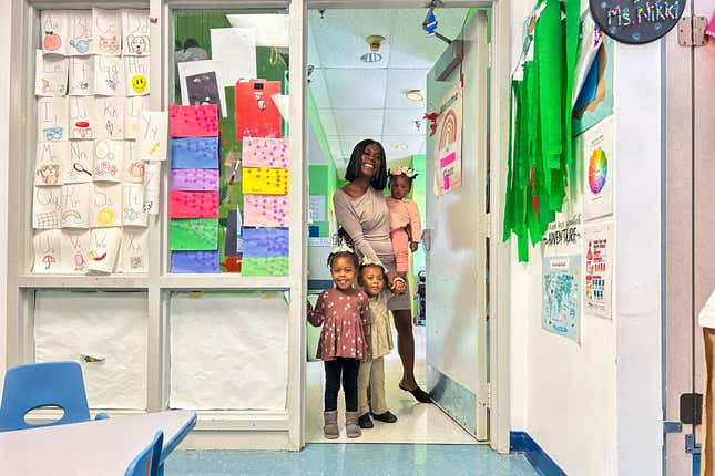 This March 2024 photo provided by The Hechinger Report shows Derrika Richard as she walks her three youngest children to their child care classrooms at Clara&#39;s Little Lambs in New Orleans. (Ariel Gilreath/The Hechinger Report via AP)