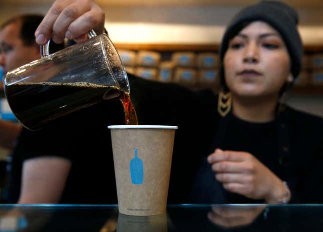 Barista Yana Powers pours drip coffee at Blue Bottle Coffee in San Francisco. 