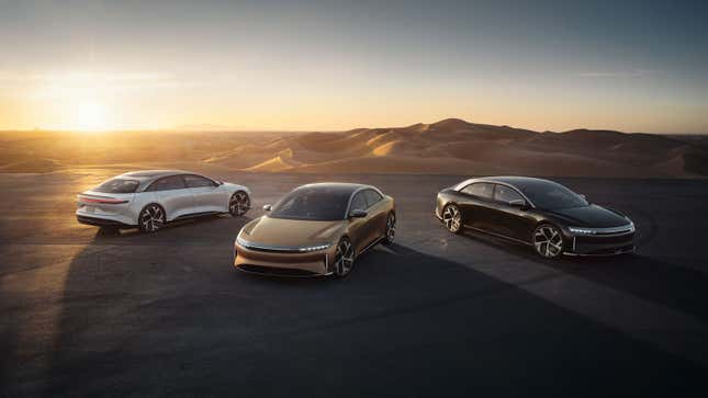 A photo of three electric Lucid Air sedans. 