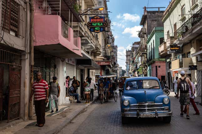 FILE - An American classic car makes its way down a street in Havana, Cuba, Nov. 11, 2023. The Cuban government says it will have to either increase prices for fuel and electricity, or reduce rations for basic supplies. President Miguel Díaz-Canel said Friday, Dec. 22, 2023, that difficult measures were needed for difficult times. (AP Photo/Ramon Espinosa, File)