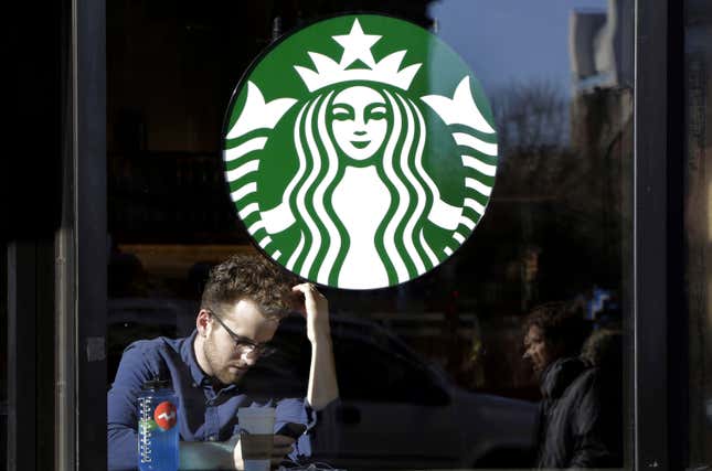 FILE - A man sits inside a Starbucks, in New York, Jan. 11, 2016. An independent review of Starbucks&#39; labor relations concluded that Starbucks should better communicate its commitment to workers’ collective bargaining rights and train its employees to respect those rights. Starbucks released the assessment Wednesday, Dec. 13, 2023. (AP Photo/Mark Lennihan, File)