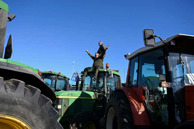 Protesting farmers with their tractors take part in a rally outside annual Agrotica trade fair in the port city of Thessaloniki, northern Greece, Saturday, Feb. 3, 2024. Greek farmers – hit by rising costs and crop damage caused by recent floods and wildfires – gathered around the conference center hosting the event in the northern city of Thessaloniki to underline their determination to escalate protests over rising production costs by blocking highways. (AP Photo/Giannis Papanikos)