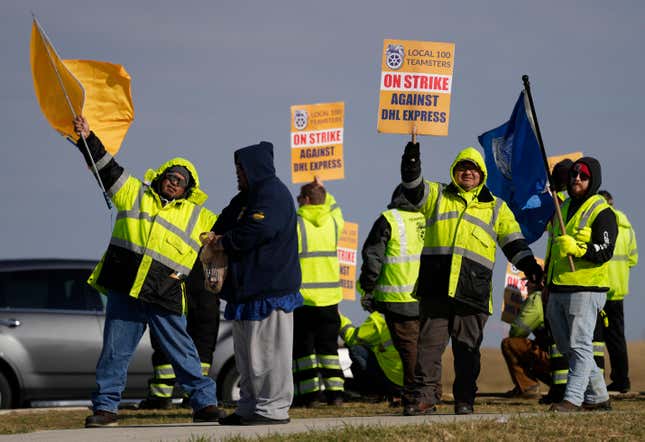 Teamsters protest at Cincinnati/Northern Kentucky International Airport near the DHL Express Hub Friday, Dec. 8, 2023, in Erlanger Ky. More than 1,000 union members at DHL walked off the job at Cincinnati/Northern Kentucky International Airport, a critical logistics hub for the package delivery company, during the busiest time of the year. The Teamsters say they are protesting unfair labor practices at the DHL Express hub. (AP Photo/Carolyn Kaster)