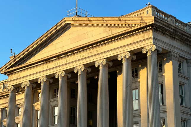 FILE - The Treasury Department is seen near sunset in Washington, Jan. 18, 2023. The Biden administration is rolling out new recordkeeping rules for U.S. investment advisers in its continued effort to clamp down on money laundering, illicit finance and fraud in the American financial system. (AP Photo/Jon Elswick, File)