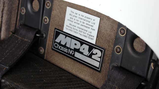 A photo of a badge inside the cockpit of a McLaren F1 car saying "MP4/2" 