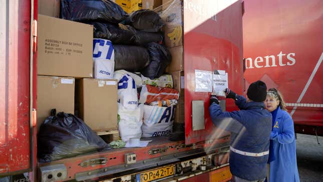 A truck loaded with items has last checks by Ukrainian and Polish employees of the transport company Smeets Ferry, in Rotterdam on March 7, 2022. - Medicines, clothing and food collected for the victims of the war in Ukraine following Russia’s invasion of its neighbour, will be transported to the Polish border. - Netherlands OUT