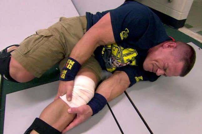 John Cena holding his knee