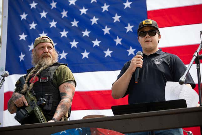 IONIA, MICHIGAN - JULY 19: Kyle Rittenhouse (right), the then-17-year-old who, in 2020, shot and killed two protestors in Kenosha, Wisconsin, claimed self-defense, and was found not guilty, speaks to supporters of the 2nd Amendment at a “Defend Our 2A: Michigan’s Fight for Self Preservation” rally at a farm on July 19, 2023 in Ionia, Michigan. The rally was moved this year from the Michigan State Capitol where it was previously held. Other speakers at the rally are former Arizona Sheriff Richard Mack, and Mark and Patricia McCloskey. 