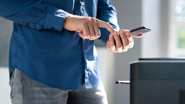 Man printing using phone 