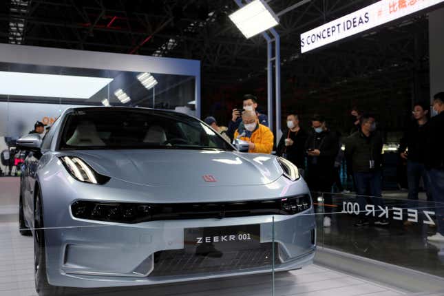 Visitors check out a Zeekr 001 in Ningbo, Zhejiang province, China, in April 2021. Zeekr has delivered hundreds of thousands of electric vehicles since it began selling the EV in October 2021.