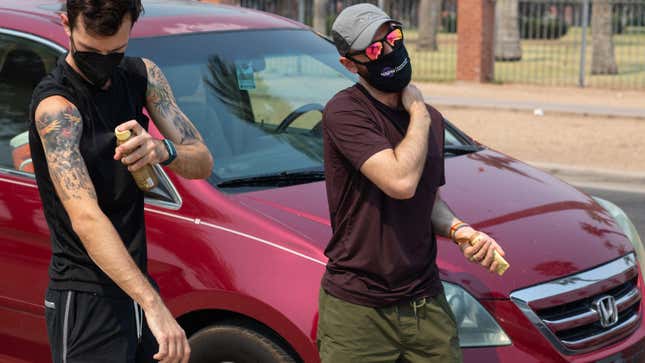  Tobias Deardorff (L) and David Vanoni put on sunscreen before passing out water and ice pops to the homeless on June 15, 2021 in Phoenix, Arizona. The National Weather Service has issued an excessive heat warning for much of central Arizona, which is expected to be in effect through the weekend. 