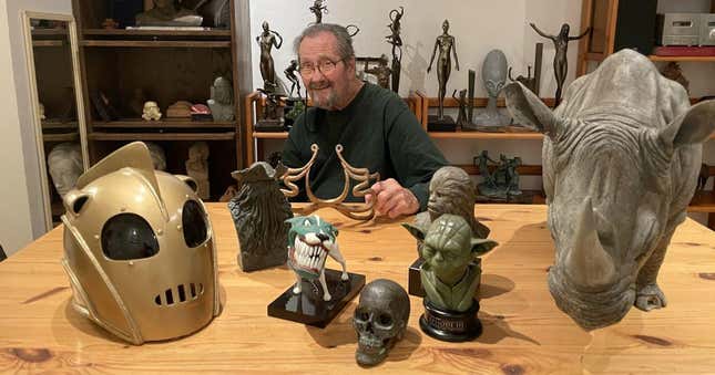Photograph of late ILM sculptor Richard Miller, with examples of his work.