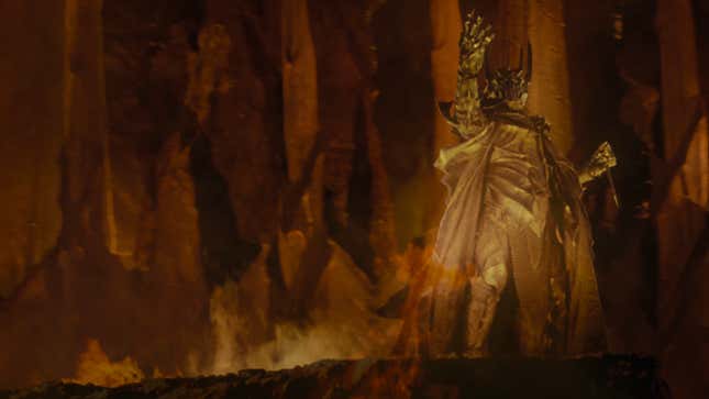 Sauron raises his hand to the sky in the heart of Mount Doom, celebrating the forging of the One Ring.
