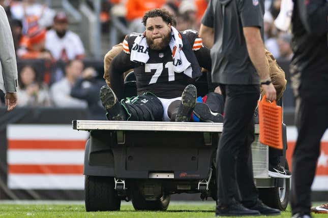 Nov 5, 2023; Cleveland, Ohio, USA; Cleveland Browns offensive tackle Jedrick Wills Jr. (71) cries as he is carted off the field following an injury during the third quarter against the Arizona Cardinals at Cleveland Browns Stadium.