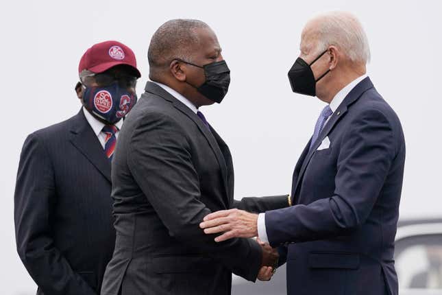 President Joe Biden is greeted by Columbia Mayor Steve Benjamin and Rep. Jim Clyburn, D-S.C., left, as he arrives at Columbia Metropolitan Airport on Air Force One in West Columbia, S.C., Dec. 17, 2021.