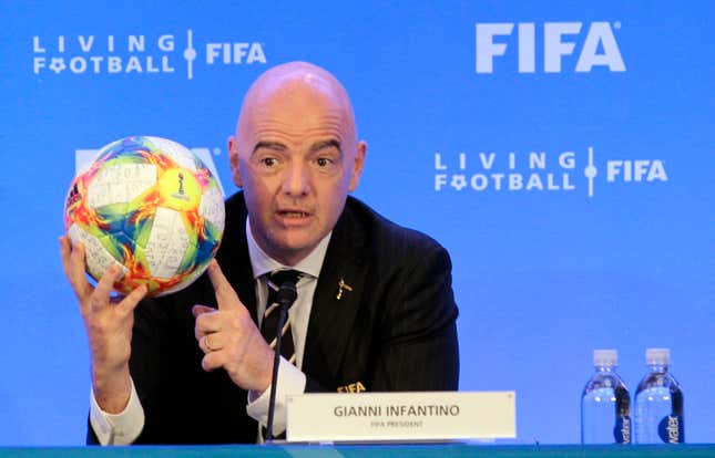 FILE - FIFA President Gianni Infantino holds a soccer ball as he speaks during a press conference after the FIFA Council Meeting, Friday, March 15, 2019, in Miami. FIFA is moving more than 100 jobs from its Swiss headquarters to Florida where a growing workforce is already working on organizing the 2026 World Cup. FIFA informed staff Tuesday, Sept. 26, 2023 the entire legal department plus audit, compliance and risk management teams will move from Zurich to Coral Gables near Miami. (AP Photo/Luis M. Alvarez, File)