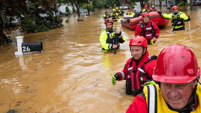 Members of the New Market Volunteer Fire Company perform a secondary search during an evacuation effort following a flash flood in Helmetta, New Jersey, on August 22, 2021, as a result of Tropical Storm Henri.