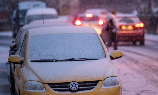 17 January 2024, Saxony, Leipzig: Cars drive along a snow-covered road in Leipzig. On the same day, the German Weather Service warned of extremely icy conditions and heavy snowfall in parts of Germany.