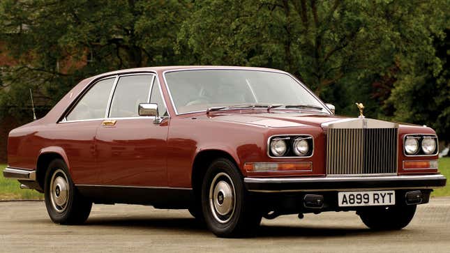 A photo of a dark red Rolls Royce car. 