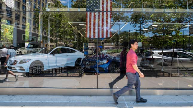 A person walks by a car dealership on June 10, 2022 in New York City. The Labor Department announced on Monday that consumer prices rose 8.6% last month from a year earlier. Inflation has risen to its highest level in four decades, raising the cost of airfare, hotels, vehicles, gas, and food. 