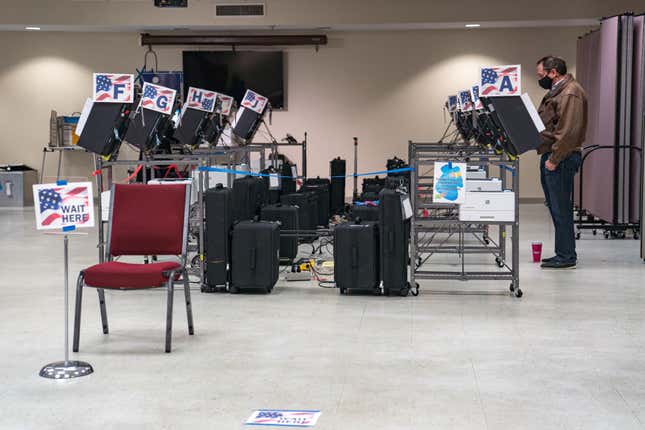 A man casts his ballot at a voting location in Cobb County on January 5, 2021, in Atlanta, Georgia. 