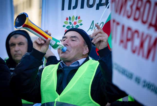 A protester blows a horn during farmers protest in front of the Agriculture Ministry in Sofia, Monday, Feb. 5, 2024. Hundreds of angry farmers took to the streets in Bulgaria&#39;s capital, Sofia, on Monday to complain of what they call &quot;the total failure&quot; of the government to meet the mounting challenges in the agricultural sector. (AP Photo/Valentina Petrova)