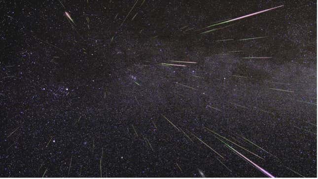 A meteor shower shoots short beams of light across a darkened sky