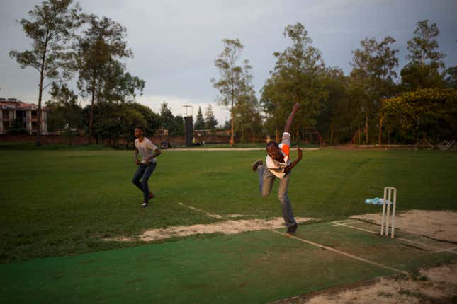 Budding cricketers take to the pitch at Kigali’s only cricket ground.