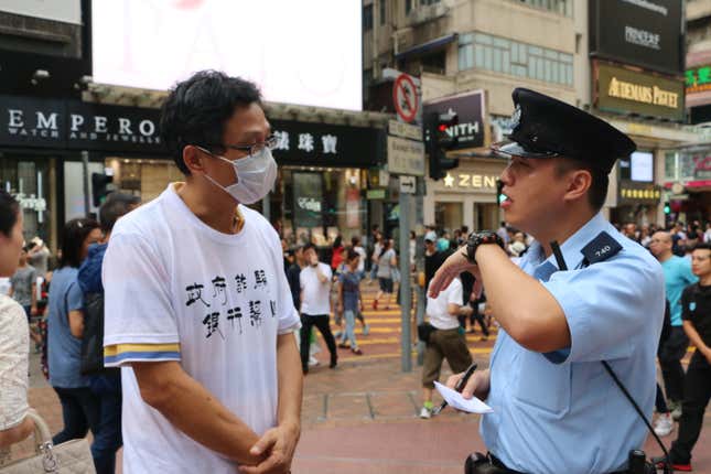 Richard talking with a Hong Kong police officer about their case.