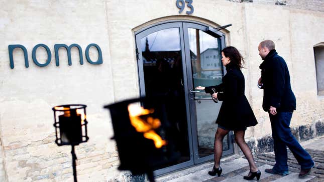 Woman and man enter Noma restaurant.