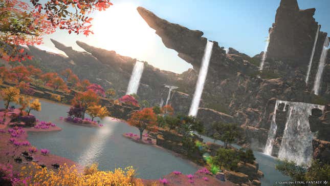 Vista with a lake, colorful trees, and waterfalls