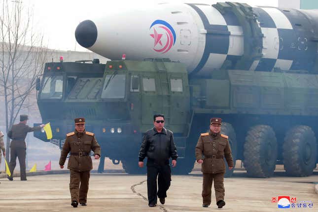 FILE - In this photo distributed by the North Korean government, North Korean leader Kim Jong Un, center, walks around what it says is a Hwasong-17 intercontinental ballistic missile (ICBM) on the launcher at an undisclosed location in North Korea on March 24, 2022. Independent journalists were not given access to cover the event depicted in this image distributed by the North Korean government. The content of this image is as provided and cannot be independently verified. Korean language watermark on image as provided by source reads: &quot;KCNA&quot; which is the abbreviation for Korean Central News Agency. (Korean Central News Agency/Korea News Service via AP, File)