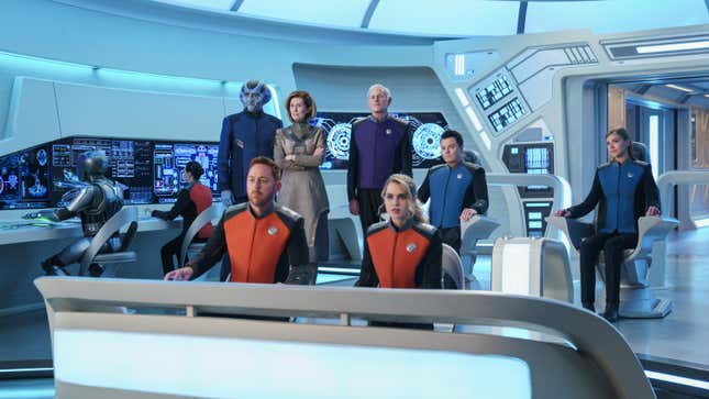 The cast of The Orville gather on the bridge of the ship.