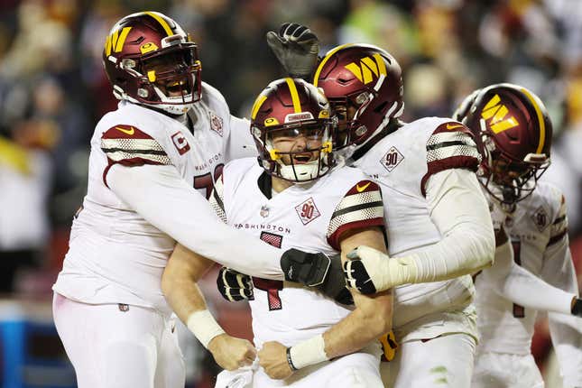 LANDOVER, MARYLAND - JANUARY 08: Sam Howell #14 of the Washington Commanders celebrates after scoring a touchdown in the third quarter of the game against the Dallas Cowboys at FedExField on January 08, 2023 in Landover, Maryland. (Photo by Rob Carr/Getty Images)