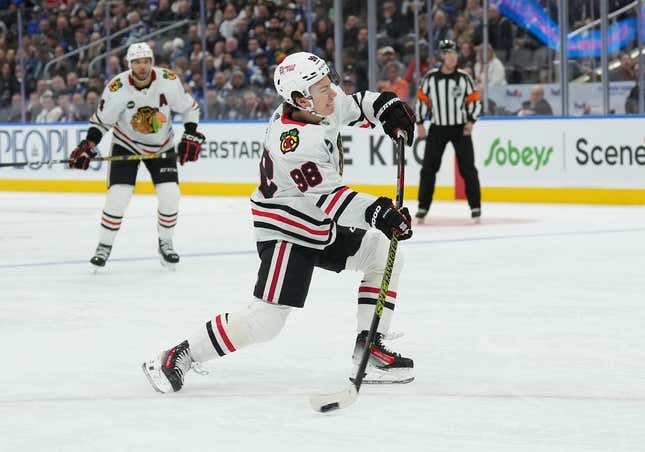 Oct 16, 2023; Toronto, Ontario, CAN; Chicago Blackhawks center Connor Bedard (98) shoots the puck on net against the Toronto Maple Leafs during the second period at Scotiabank Arena.