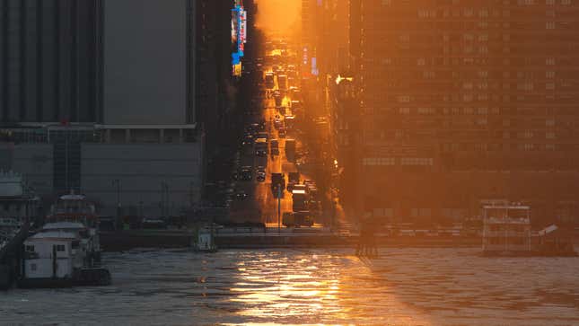 An ice floe floats on the Hudson River as the sun rises over 42nd Street in New York City on January 24, 2025, as seen from Weehawken, New Jersey.