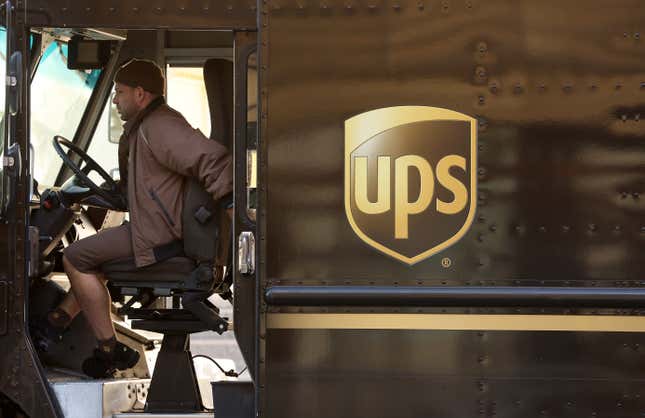 A UPS driver sits in his delivery truck on January 31, 2023 in San Francisco, California. 