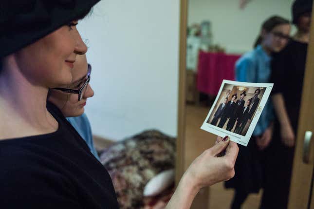 Shtern-Sara Cherkassky looking at a photograph of her husband Asher, taken before the war.