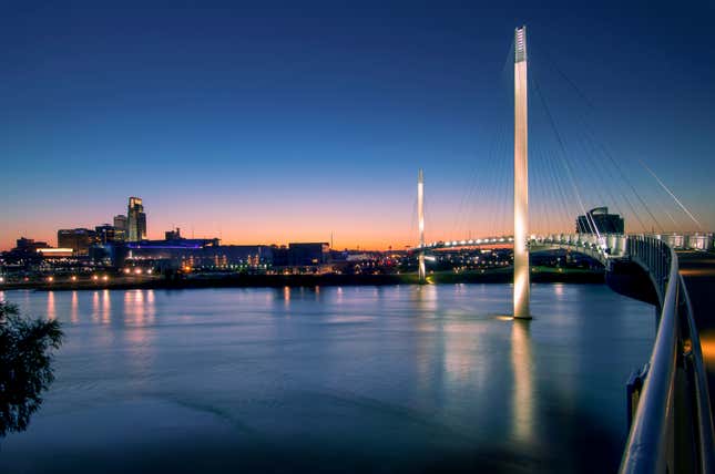 nighttime shot of a bridge over a river